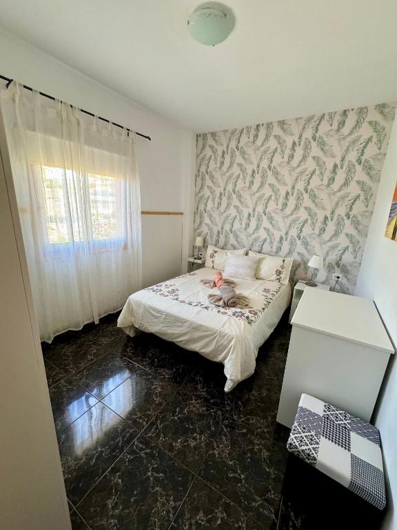 Posteľ alebo postele v izbe v ubytovaní Naomi’s House