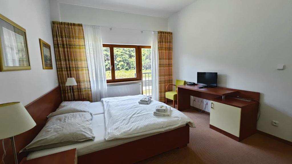 Postel nebo postele na pokoji v ubytování Geyserpark Village
