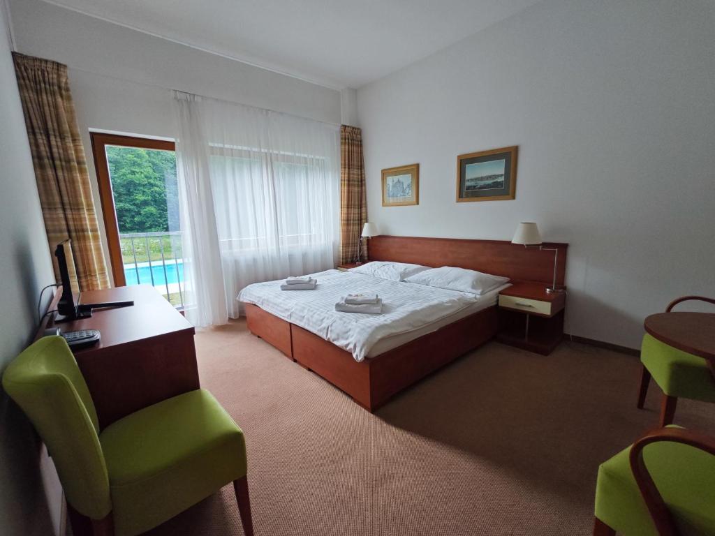 Postel nebo postele na pokoji v ubytování Geyserpark Village