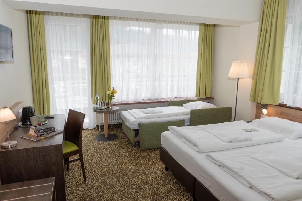 Postel nebo postele na pokoji v ubytování Hotel Lindenhof