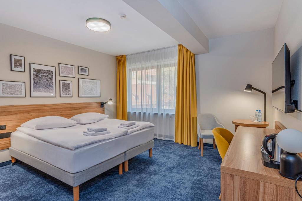 Postel nebo postele na pokoji v ubytování Tulip Hotels - Wroclaw Centre