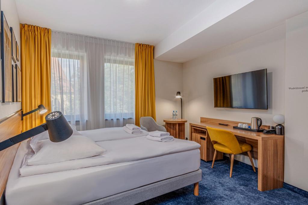 Postel nebo postele na pokoji v ubytování Tulip Hotels - Wroclaw Centre