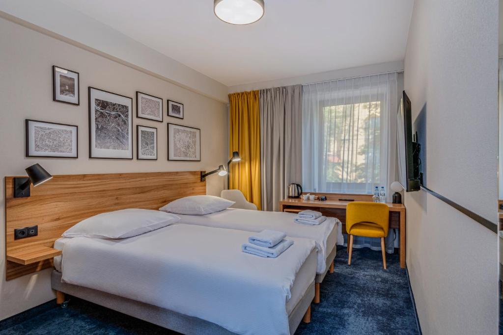 Postel nebo postele na pokoji v ubytování Tulip Hotels - Wroclaw Centre