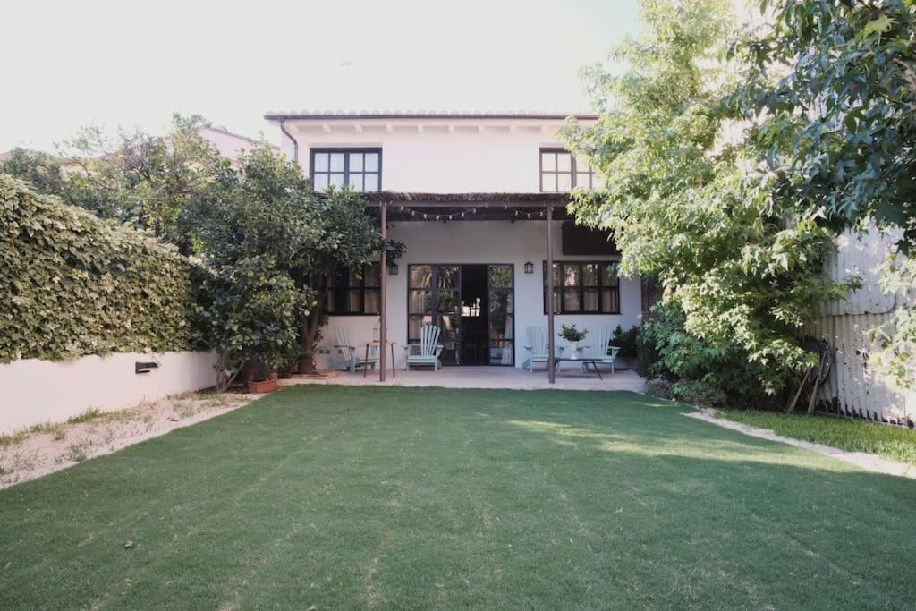 a house with a lawn in front of it at La Casa del Jardín in Candeleda