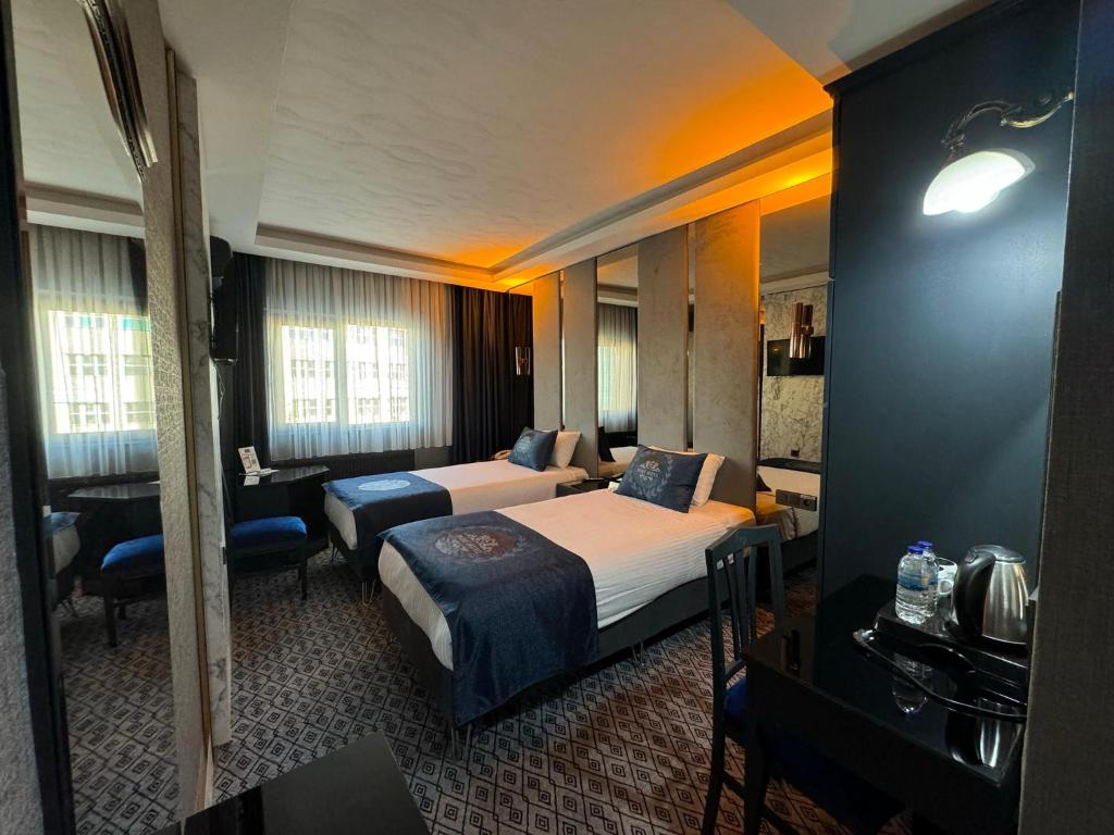 Postel nebo postele na pokoji v ubytování BÇ Ruby Hotel