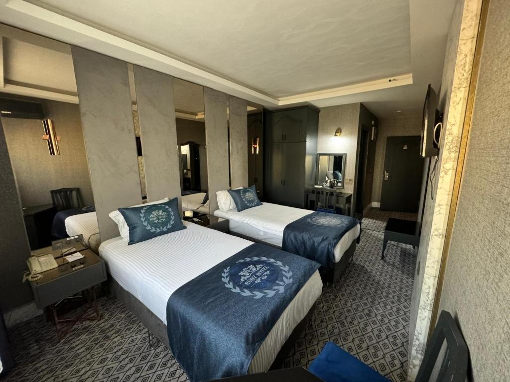 Postel nebo postele na pokoji v ubytování BÇ Ruby Hotel