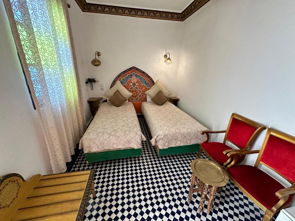 Postel nebo postele na pokoji v ubytování Riad Shama Fes