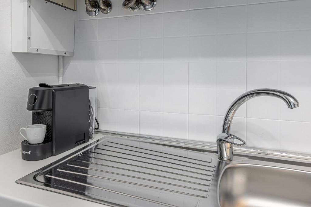Kuchyň nebo kuchyňský kout v ubytování Gallarate Central Suite