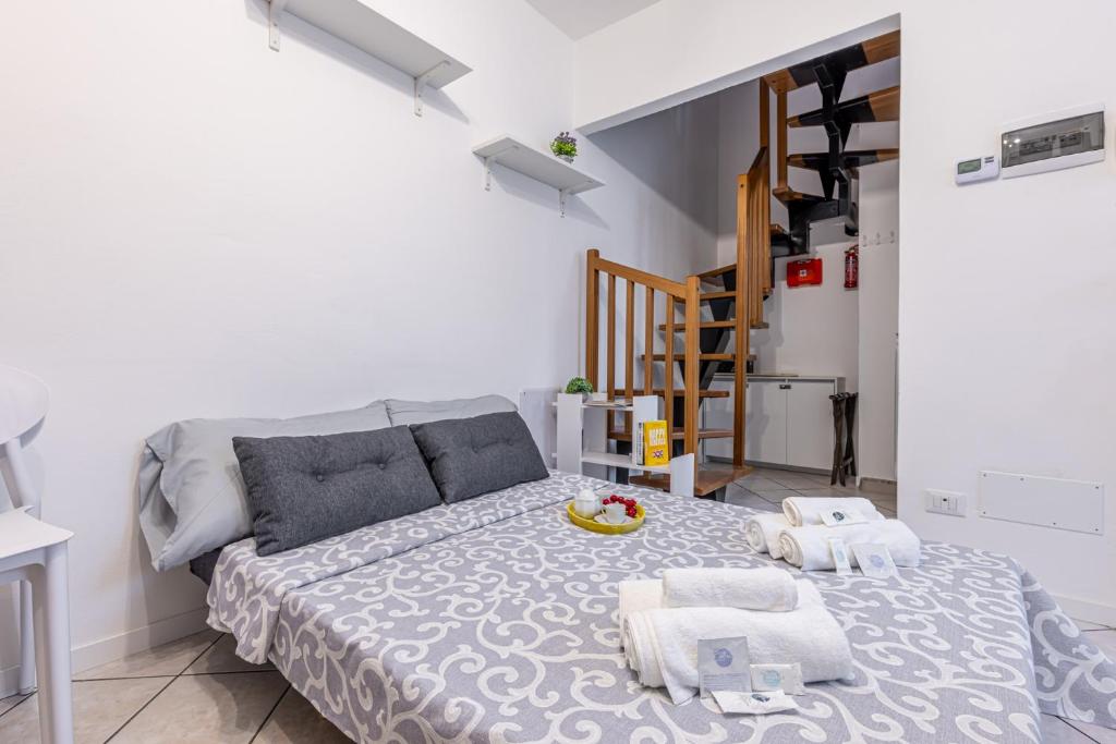 Postel nebo postele na pokoji v ubytování Gallarate Central Suite