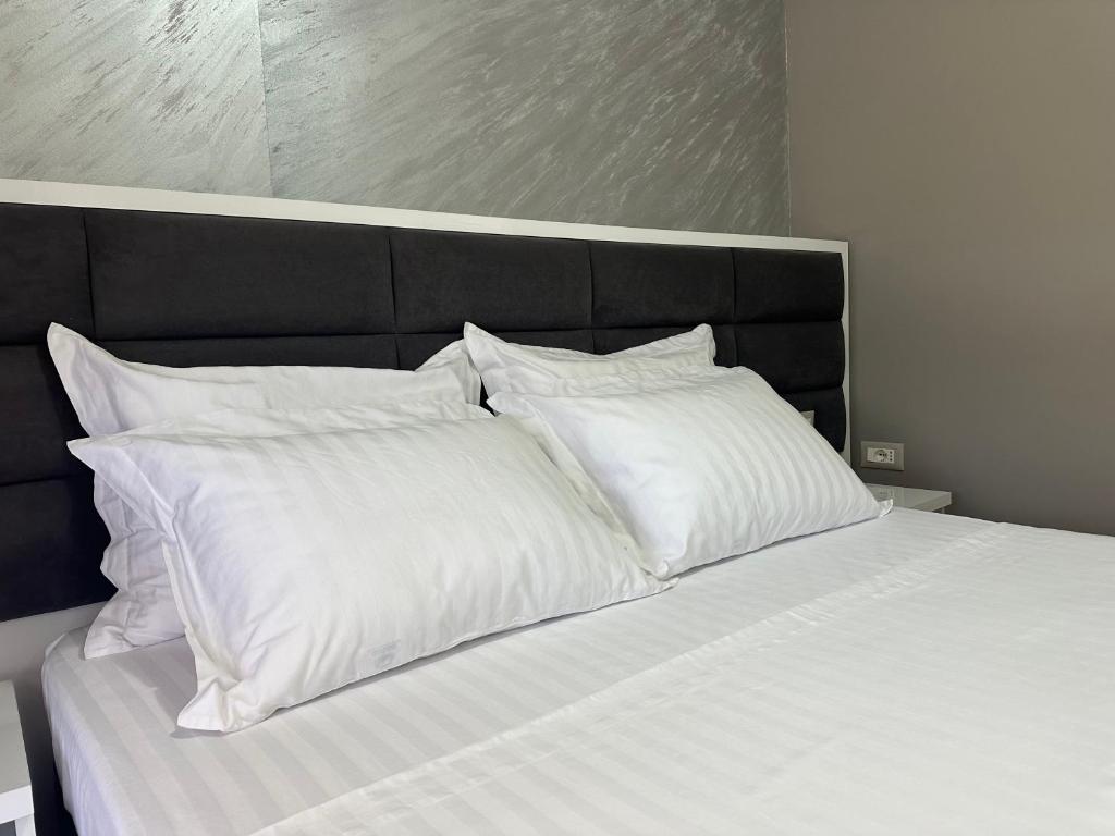 Postel nebo postele na pokoji v ubytování Belle Apartment