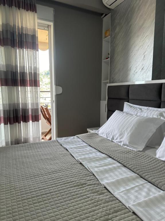 Postel nebo postele na pokoji v ubytování Belle Apartment