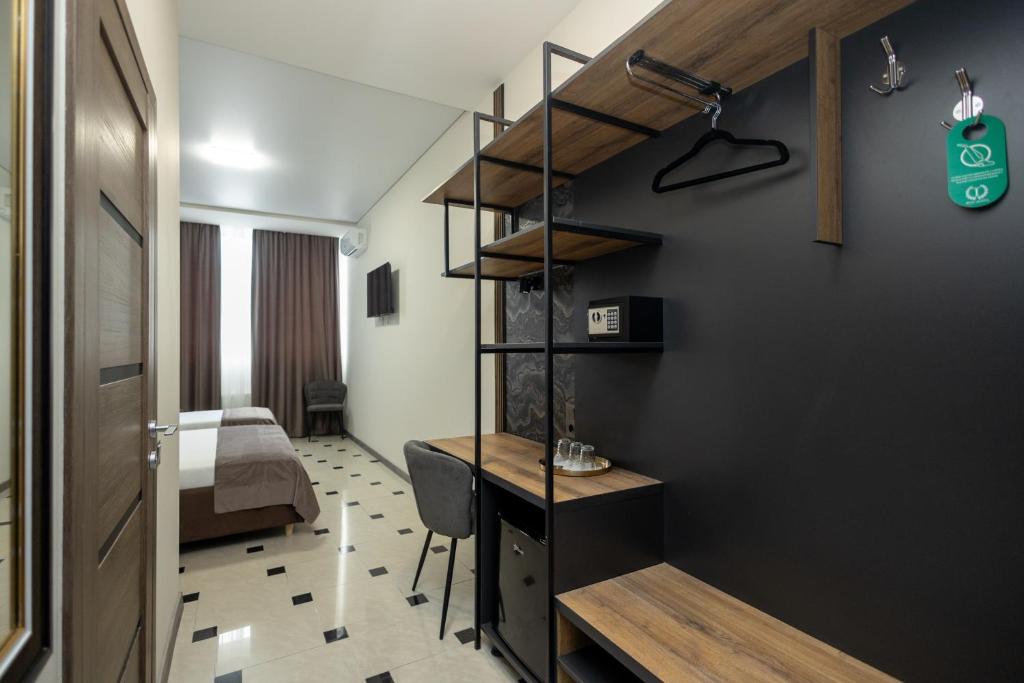 Postel nebo postele na pokoji v ubytování IRIS Hotel