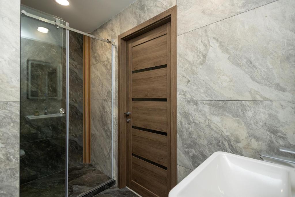 Koupelna v ubytování IRIS Hotel