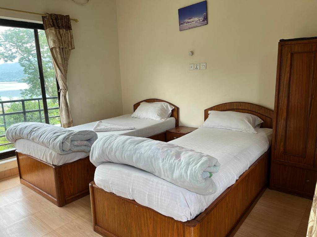 Postel nebo postele na pokoji v ubytování New elites guest house