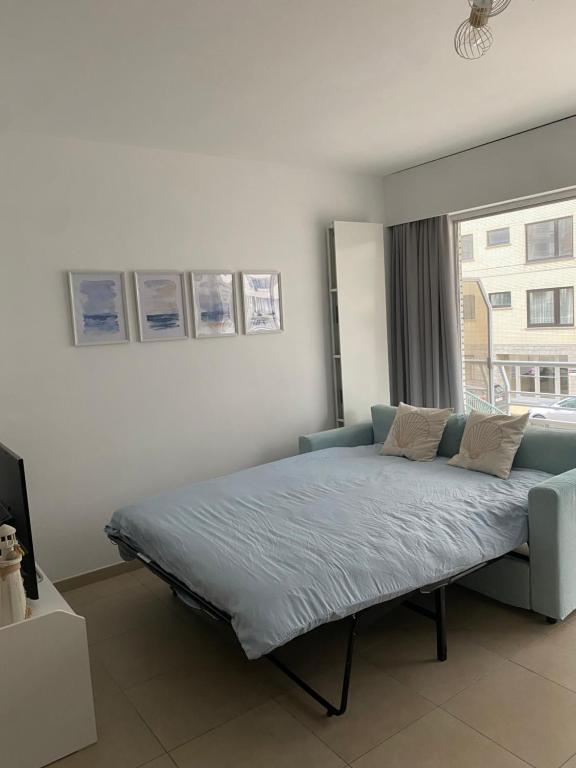 Ένα ή περισσότερα κρεβάτια σε δωμάτιο στο Appartement Westhinder te Middelkerke