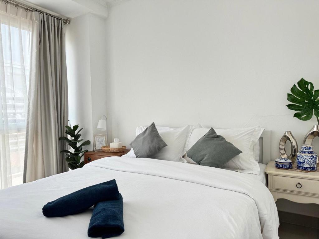 Ένα ή περισσότερα κρεβάτια σε δωμάτιο στο STAYDII serviced residence Chaengwattana