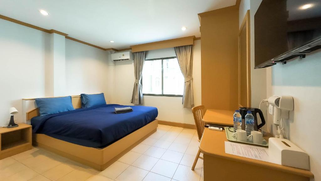 Postel nebo postele na pokoji v ubytování JB House Patong