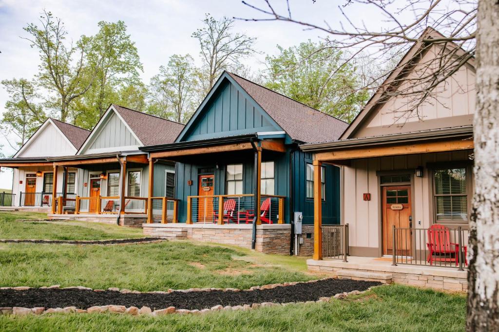 a row of houses with orange and blue at Azalea & Blackberry Cabins in Jasper