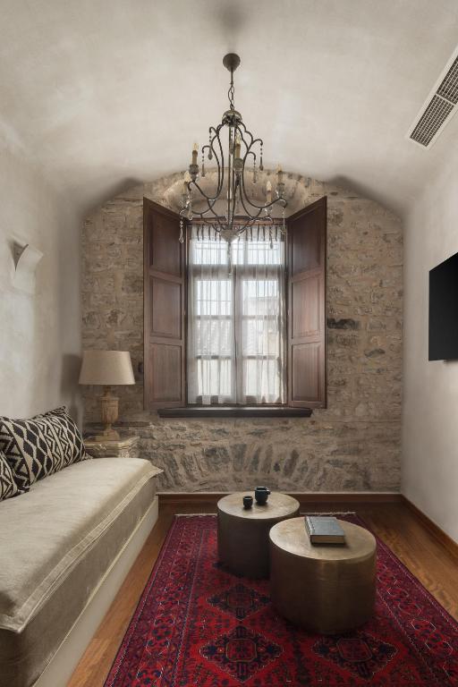 Postel nebo postele na pokoji v ubytování Stoes Boutique Hotel