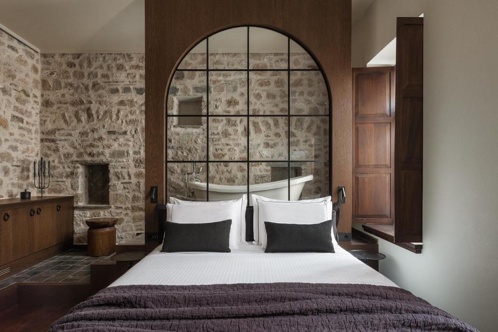 Postel nebo postele na pokoji v ubytování Stoes Boutique Hotel