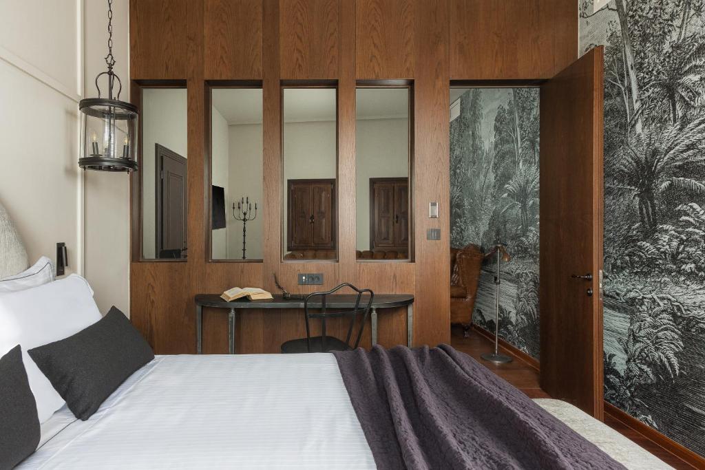 Postel nebo postele na pokoji v ubytování Stoes Boutique Hotel
