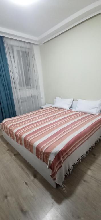 Postel nebo postele na pokoji v ubytování Apartments Lezzet