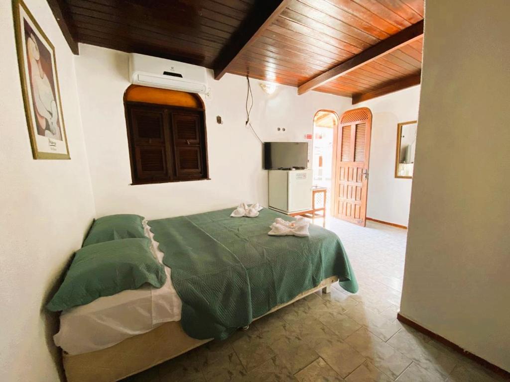 Postel nebo postele na pokoji v ubytování Pousada Tropicalia
