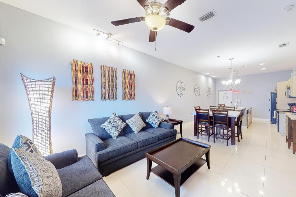 a living room with a couch and a dining room at La Isla Condominiums #C105 in South Padre Island