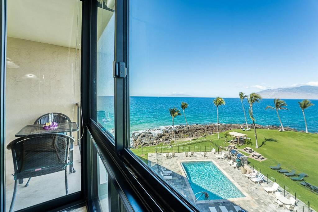 a view of the ocean from a room with a window at KS507 Spectacular Oceanfront with Split AC Wailea in Wailea