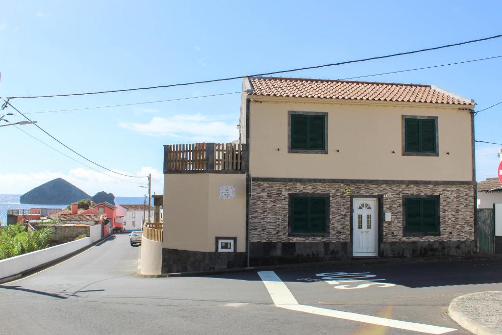 a building on the side of a street at House 37North in Mosteiros