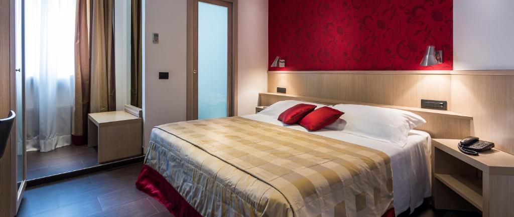 Postel nebo postele na pokoji v ubytování Hotel De Petris