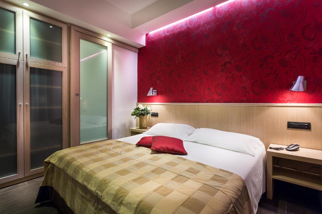 Postel nebo postele na pokoji v ubytování Hotel De Petris
