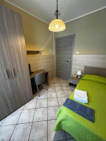 Postel nebo postele na pokoji v ubytování Albergo Carla