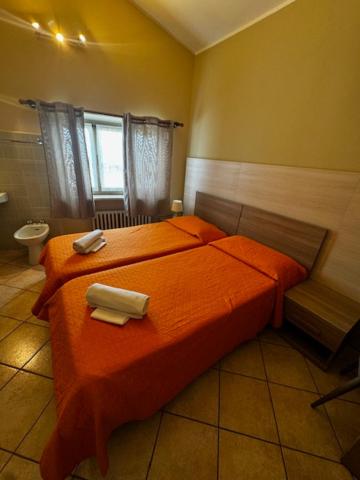 Postel nebo postele na pokoji v ubytování Albergo Carla
