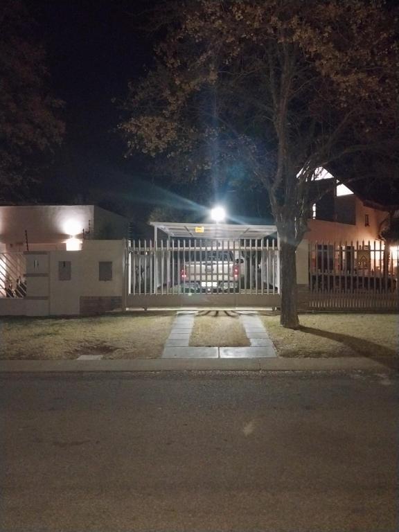 a fence in front of a house at night at De La Grace in Potchefstroom