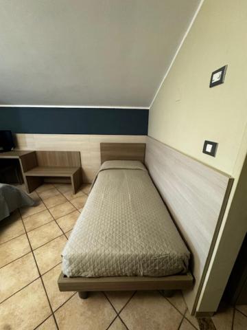 Postel nebo postele na pokoji v ubytování Albergo Carla