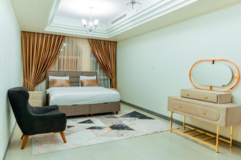 Кровать или кровати в номере Niamey Mall & Residence