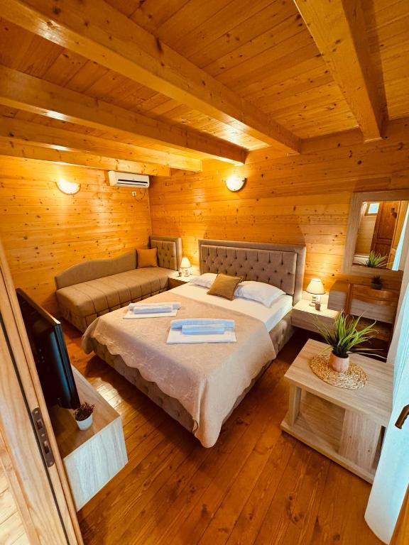 Postel nebo postele na pokoji v ubytování Apart Hotel Llolla