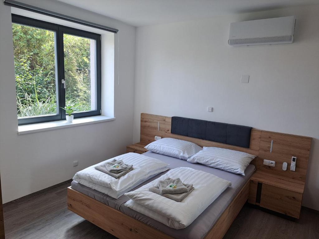 Postel nebo postele na pokoji v ubytování Apartmány Lucie