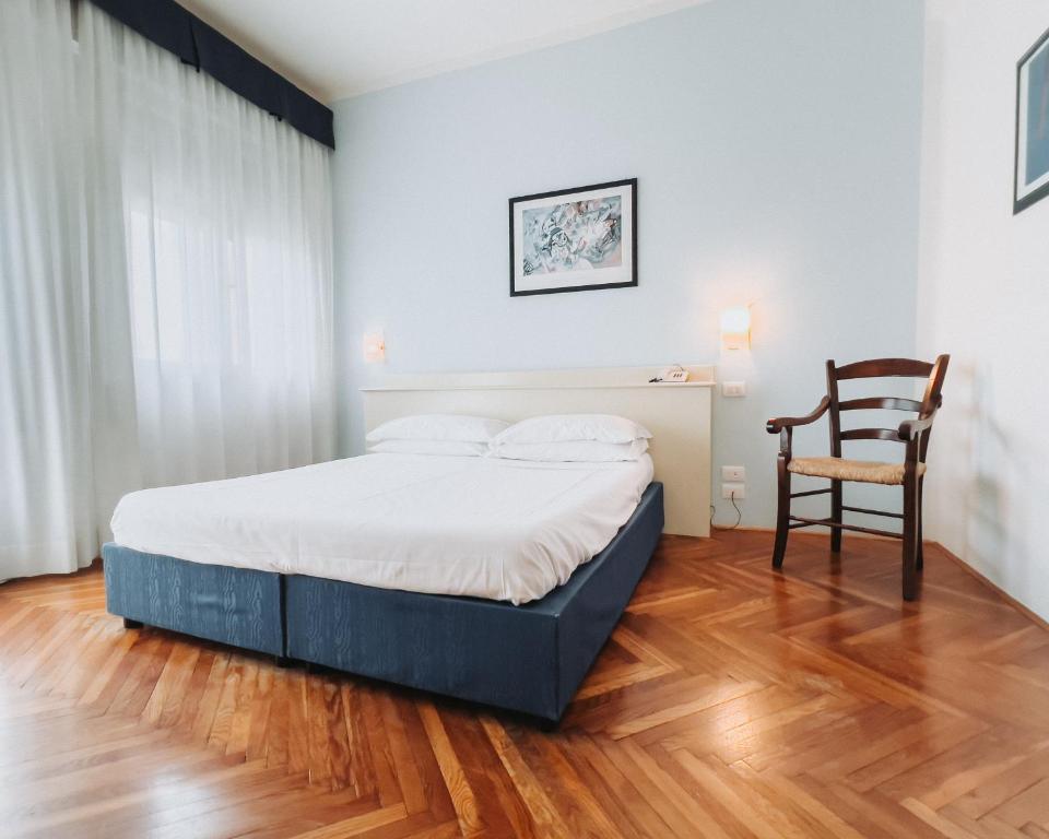 Postel nebo postele na pokoji v ubytování Hotel all'Oasi