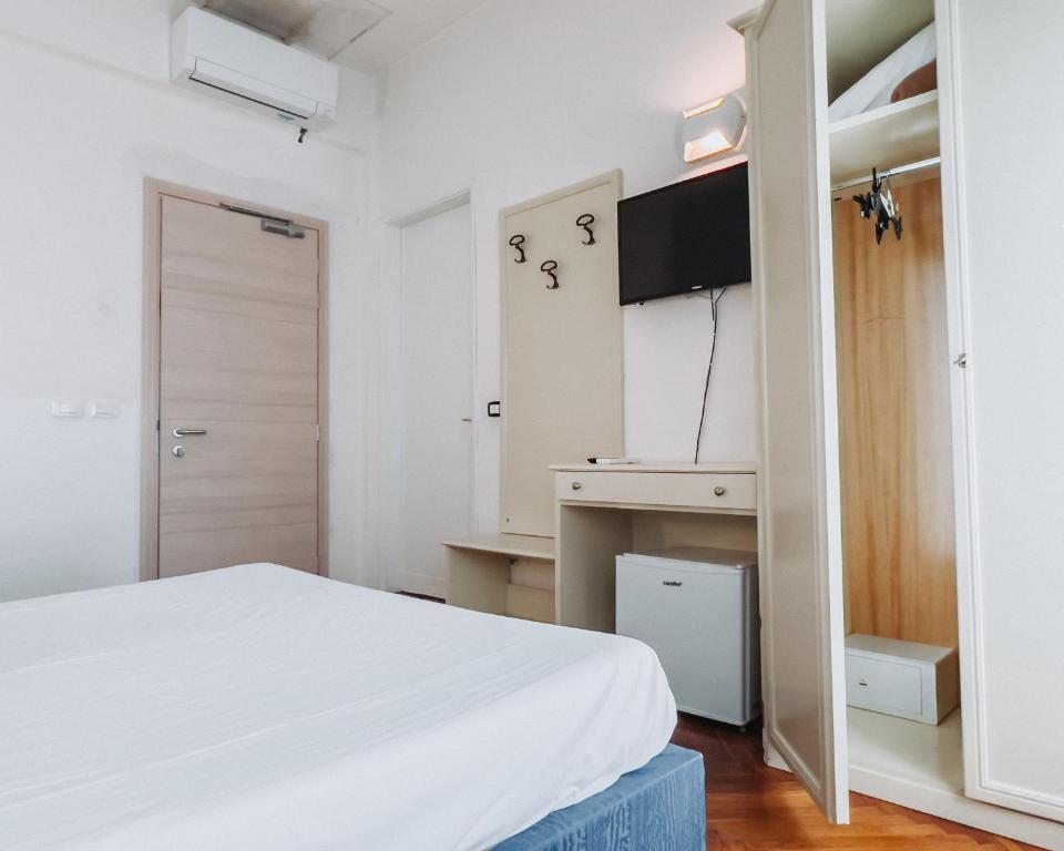 Postel nebo postele na pokoji v ubytování Hotel all'Oasi