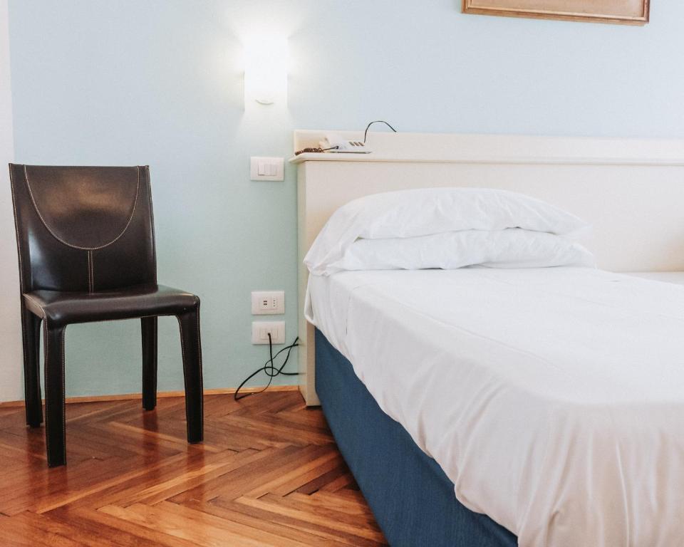 Postel nebo postele na pokoji v ubytování Hotel all'Oasi