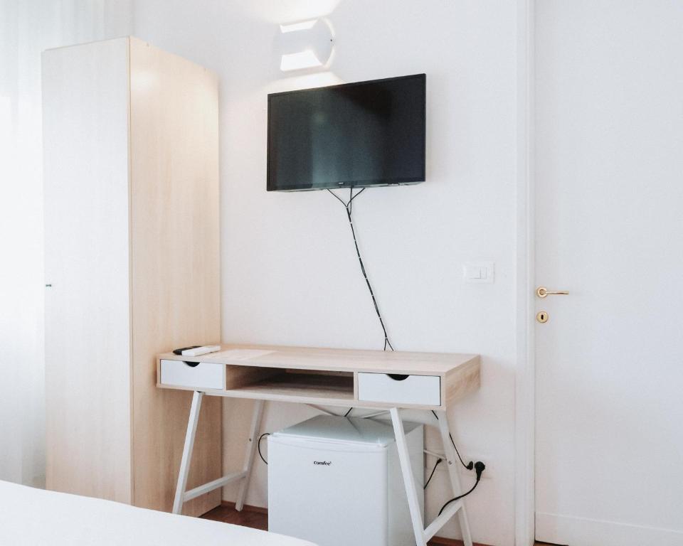 TV a/nebo společenská místnost v ubytování Hotel all'Oasi