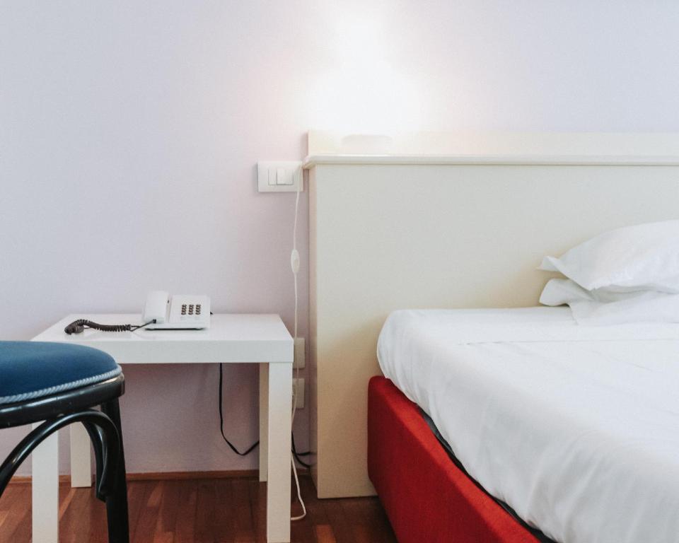 Postel nebo postele na pokoji v ubytování Hotel all'Oasi