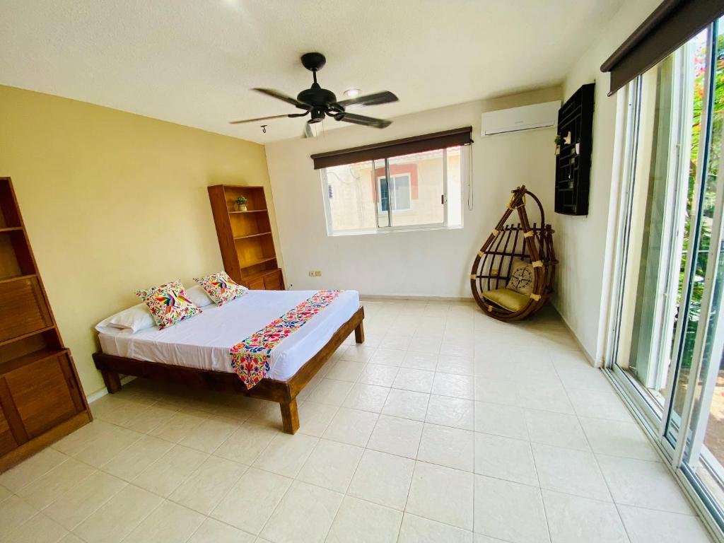Postel nebo postele na pokoji v ubytování Aguacatl Cozumel