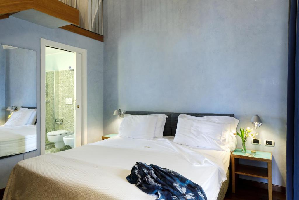Postel nebo postele na pokoji v ubytování Hotel Palazzo Papaleo