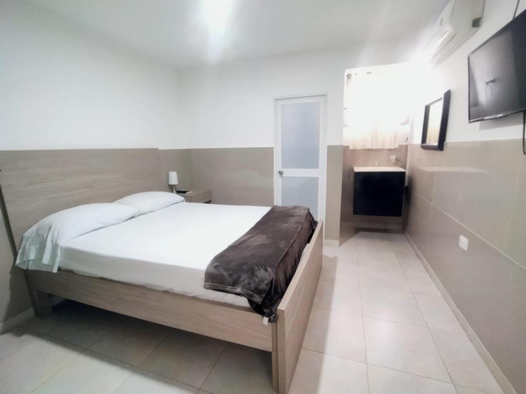 Postel nebo postele na pokoji v ubytování Hotel Winsor