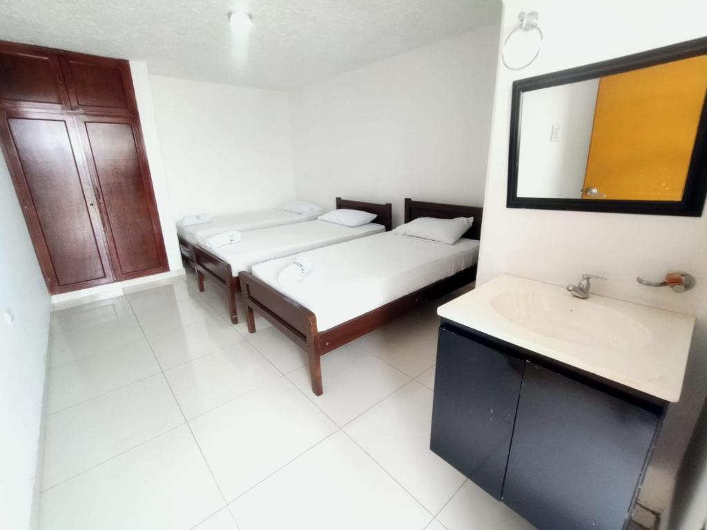 Postel nebo postele na pokoji v ubytování Hotel Winsor