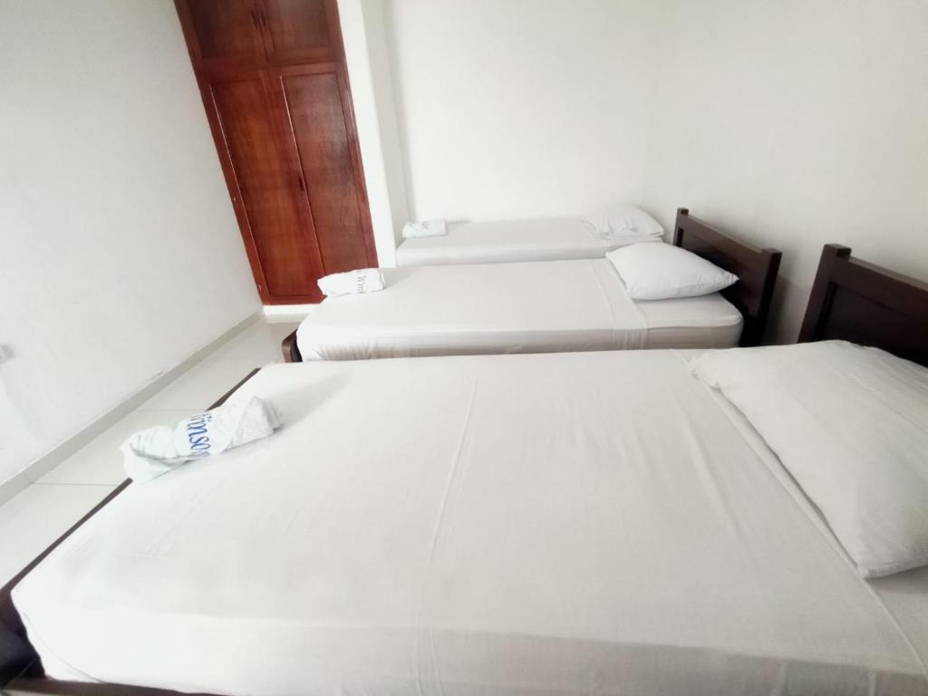 Postel nebo postele na pokoji v ubytování Hotel Winsor