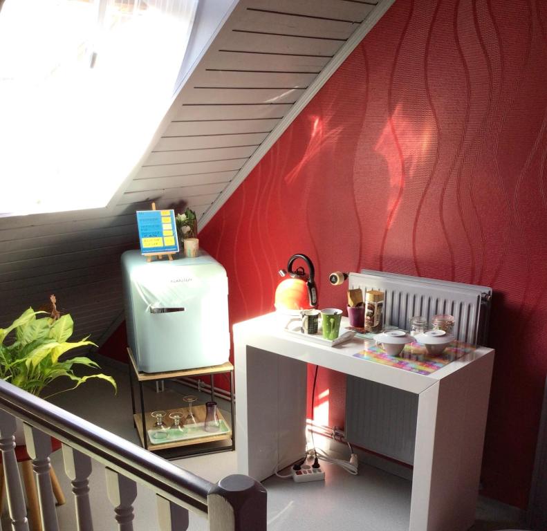 Kuchyň nebo kuchyňský kout v ubytování Chambres chez L’habitant